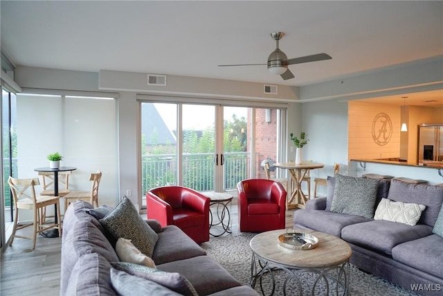 1018 Hackberry Ln Unit 113, Tuscaloosa, AL 35401 - living room with plenty of natural light and ceiling fan