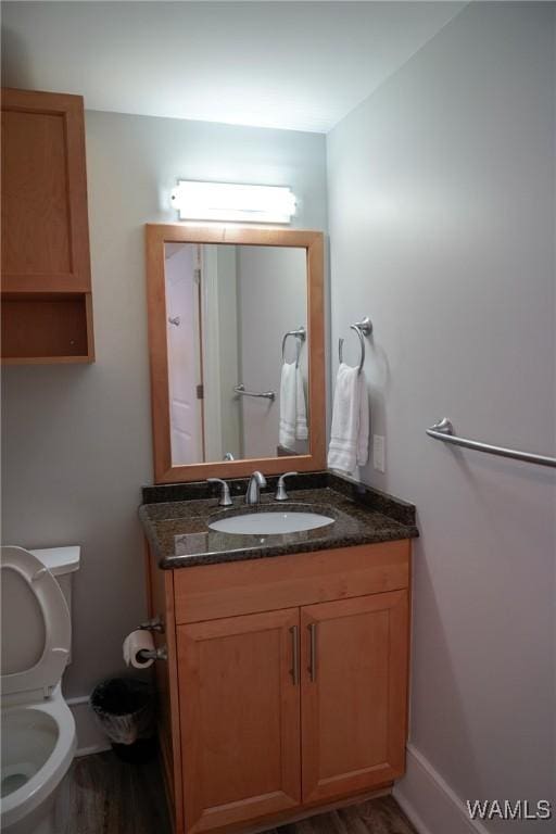 1018 Hackberry Ln Unit 113, Tuscaloosa, AL 35401 - half bathroom featuring vanity and wood finished floors