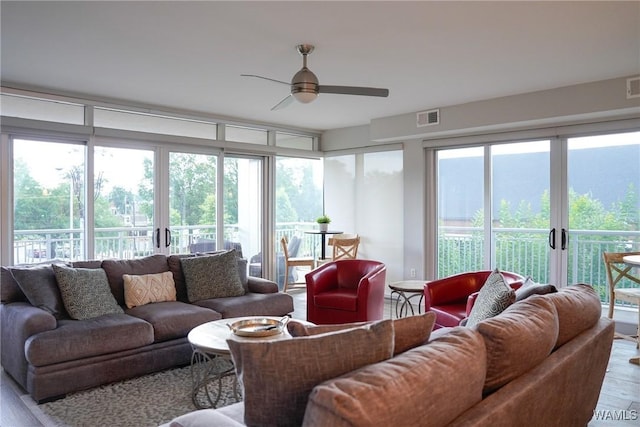 1018 Hackberry Ln Unit 113, Tuscaloosa, AL 35401 - living area with wood finished floors, a ceiling fan, and french doors
