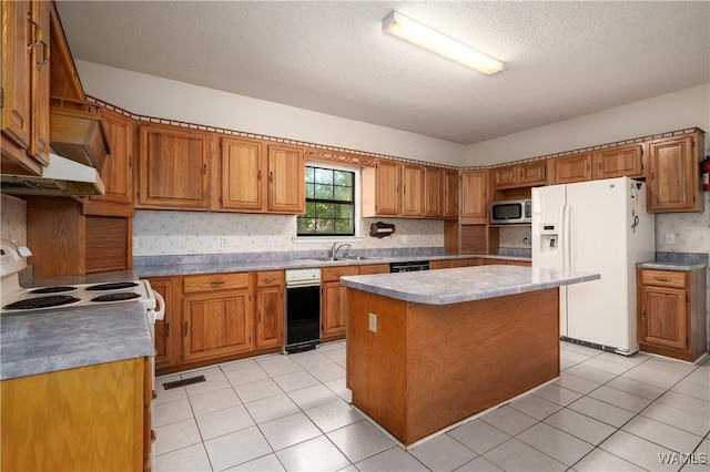 kitchen featuring light tile patterned flooring, white appliances, a kitchen island, and sink