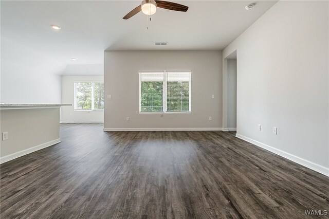 empty room featuring dark hardwood / wood-style floors and ceiling fan