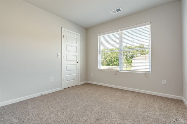 empty room featuring carpet floors