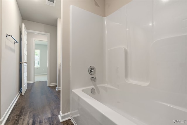 bathroom featuring shower / tub combination and hardwood / wood-style floors