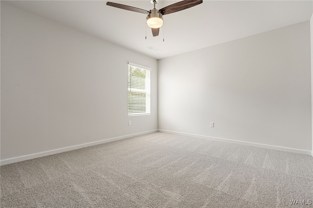 carpeted empty room with ceiling fan