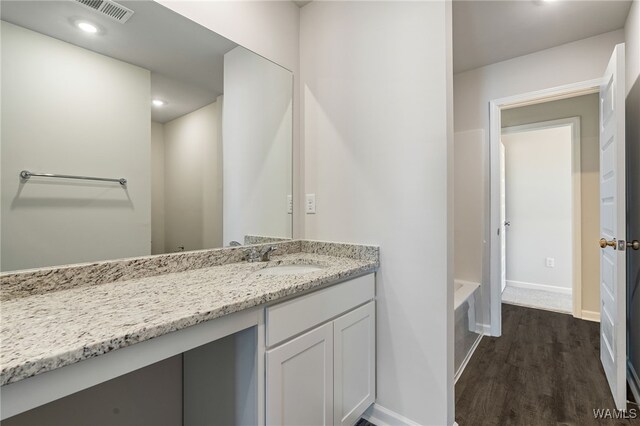 bathroom featuring wood-type flooring and vanity