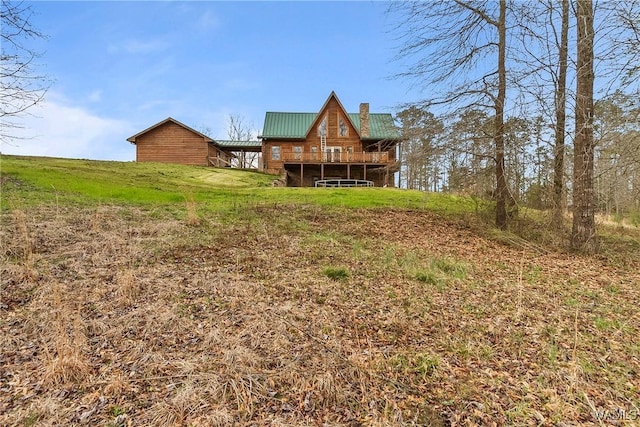 20442 Old Jasper Rd, Northport, AL 35475 - back of property featuring metal roof and a chimney