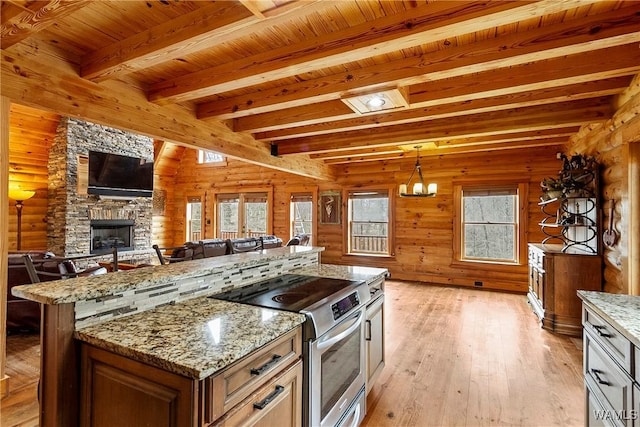 20442 Old Jasper Rd, Northport, AL 35475 - kitchen with stainless steel electric stove, a fireplace, wood ceiling, light wood-style floors, and open floor plan