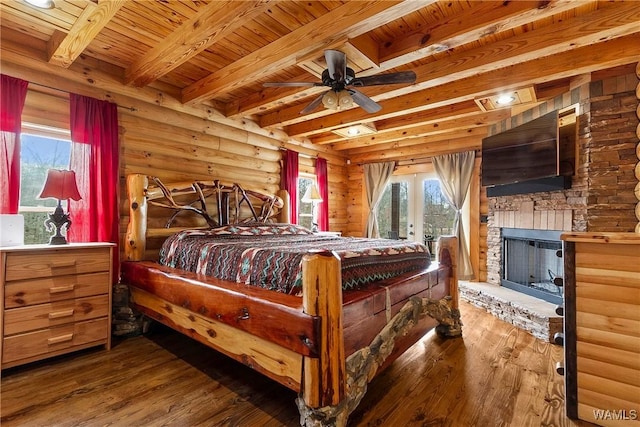 20442 Old Jasper Rd, Northport, AL 35475 - bedroom featuring wooden ceiling, beamed ceiling, wood finished floors, and rustic walls