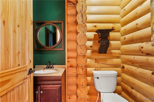 20442 Old Jasper Rd, Northport, AL 35475 - half bathroom featuring vanity, toilet, and rustic walls