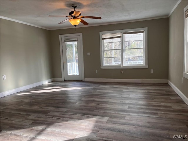 unfurnished room featuring ornamental molding, ceiling fan, and dark hardwood / wood-style flooring