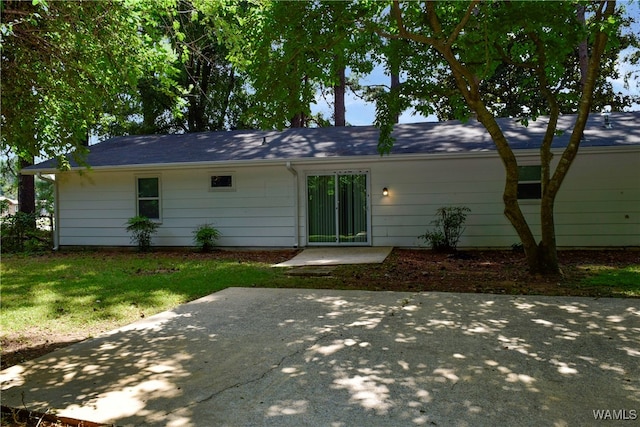 back of property with a patio