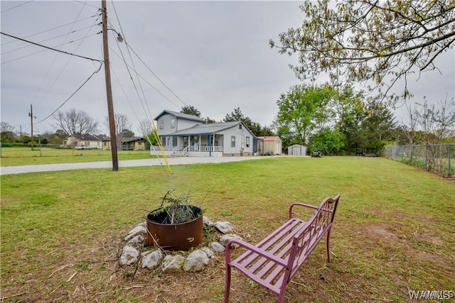 view of yard with covered porch