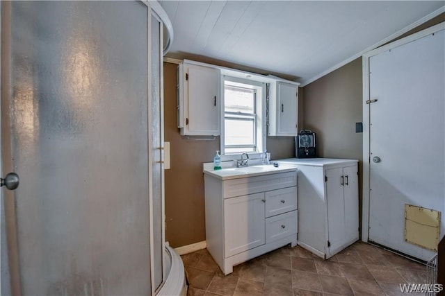 kitchen with white cabinetry and sink