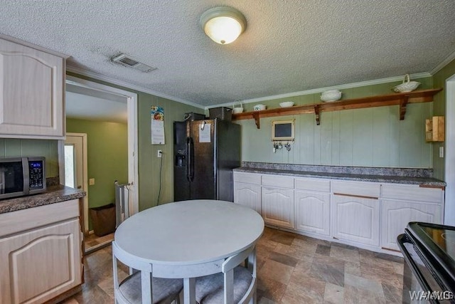 kitchen with crown molding, black appliances, and a textured ceiling