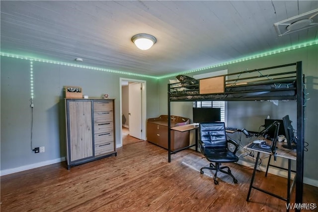 bedroom with wood-type flooring