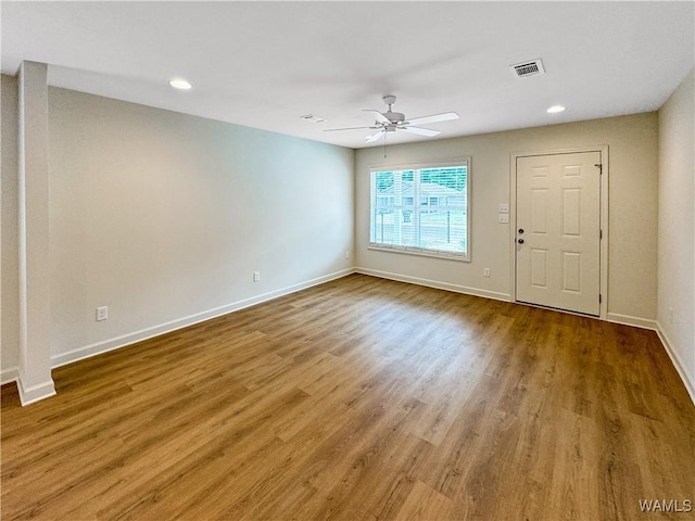 interior space featuring recessed lighting, ceiling fan, baseboards, and wood finished floors