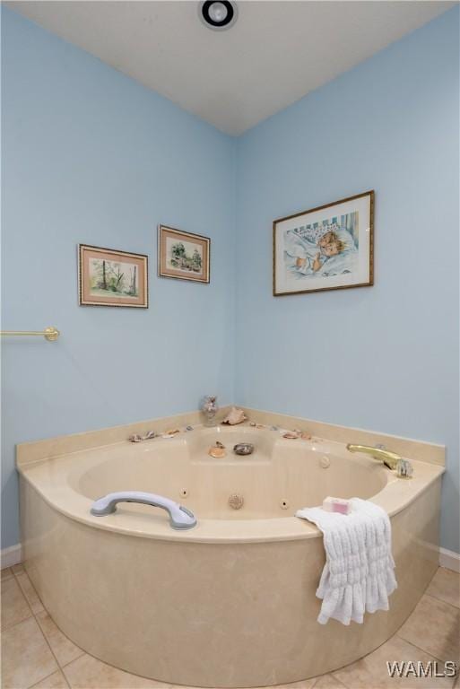 1137 Germantown Rd, Tuscaloosa, AL 35406 - bathroom with tile patterned floors and a jetted tub