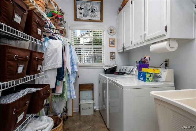 1137 Germantown Rd, Tuscaloosa, AL 35406 - laundry area with washer and clothes dryer, cabinet space, and tile patterned floors