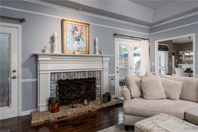 1137 Germantown Rd, Tuscaloosa, AL 35406 - living area with hardwood / wood-style flooring, a fireplace, and crown molding