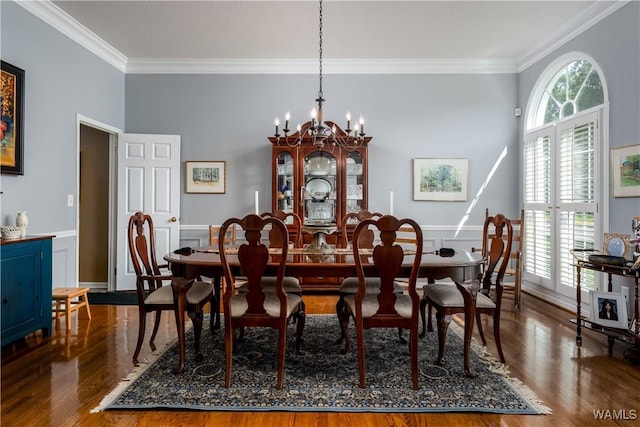 1137 Germantown Rd, Tuscaloosa, AL 35406 - dining area featuring crown molding, healthy amount of natural light, a chandelier, and wood finished floors