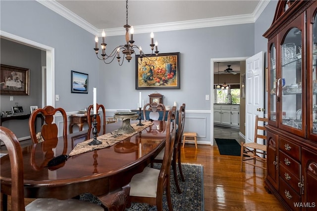 1137 Germantown Rd, Tuscaloosa, AL 35406 - dining area with a chandelier, crown molding, and wood finished floors