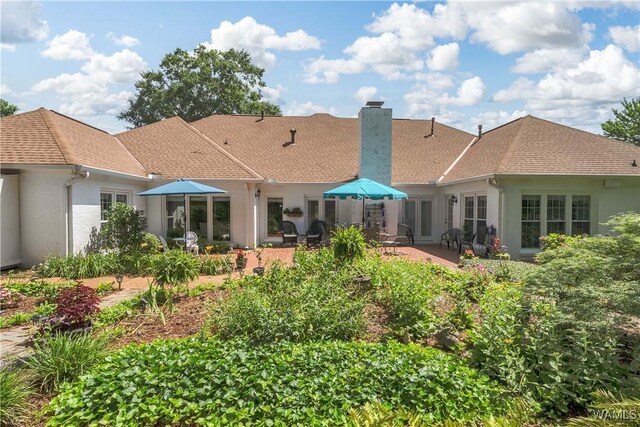 1137 Germantown Rd, Tuscaloosa, AL 35406 - rear view of house with a chimney, a patio, and a shingled roof