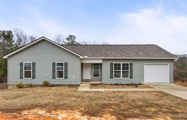 ranch-style house with a garage and a front yard