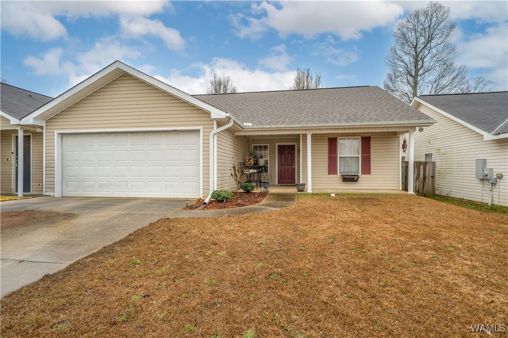 single story home featuring a garage, a porch, and a front yard