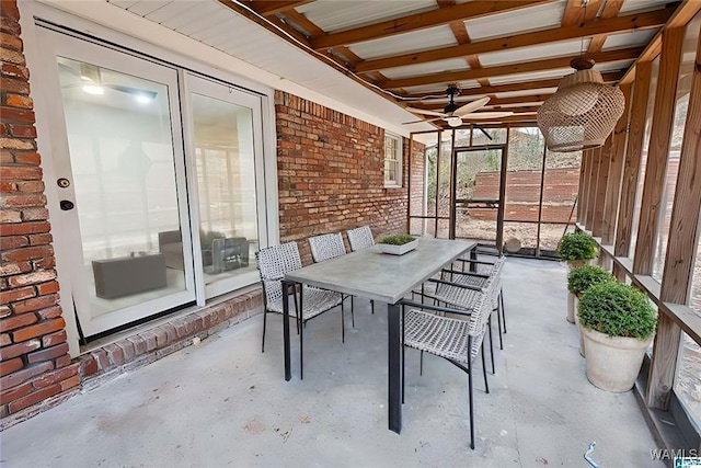 view of patio featuring outdoor dining space and a ceiling fan