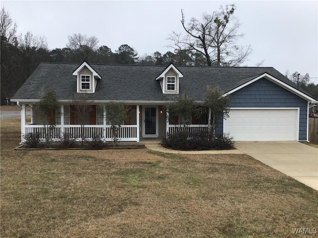 cape cod home with a shingled roof, concrete driveway, an attached garage, a porch, and a front yard