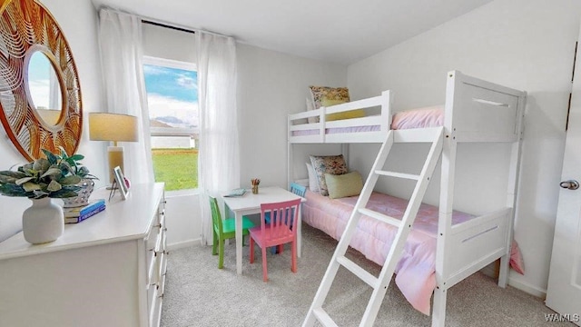 bedroom featuring light carpet