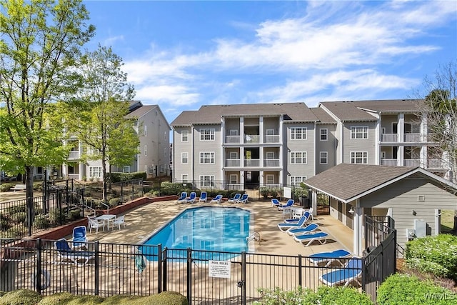 303 Helen Keller Blvd Unit B117, Tuscaloosa, AL 35404 - community pool featuring a residential view, fence, and a patio