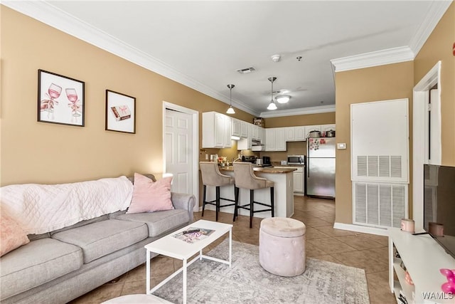 303 Helen Keller Blvd Unit B117, Tuscaloosa, AL 35404 - living room with tile patterned floors, visible vents, and ornamental molding