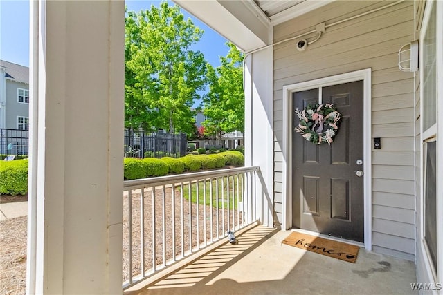 303 Helen Keller Blvd Unit B117, Tuscaloosa, AL 35404 - view of exterior entry featuring a porch and fence