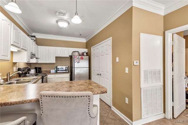 303 Helen Keller Blvd Unit B117, Tuscaloosa, AL 35404 - kitchen with visible vents, ornamental molding, a peninsula, stainless steel appliances, and light tile patterned flooring