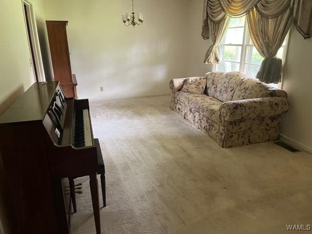 145 Lecroy Cir, Brent, AL 35034 - living room featuring carpet flooring, a chandelier, and baseboards