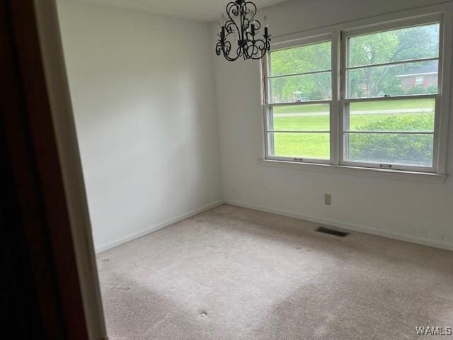 145 Lecroy Cir, Brent, AL 35034 - unfurnished room with a chandelier, carpet floors, and baseboards