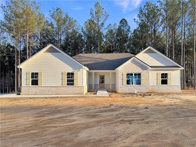 view of front of house with brick siding