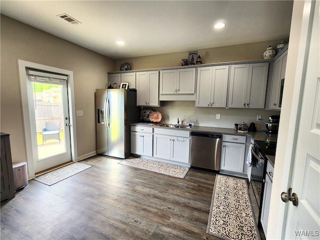 15525 Tide Water Ter, Brookwood, AL 35444 - kitchen with appliances with stainless steel finishes, a sink, dark wood finished floors, recessed lighting, and gray cabinets