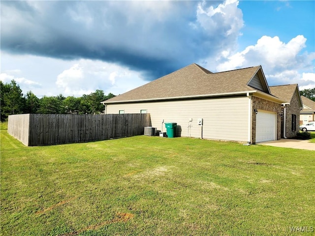15525 Tide Water Ter, Brookwood, AL 35444 - view of property exterior featuring an attached garage, driveway, a shingled roof, and central air condition unit