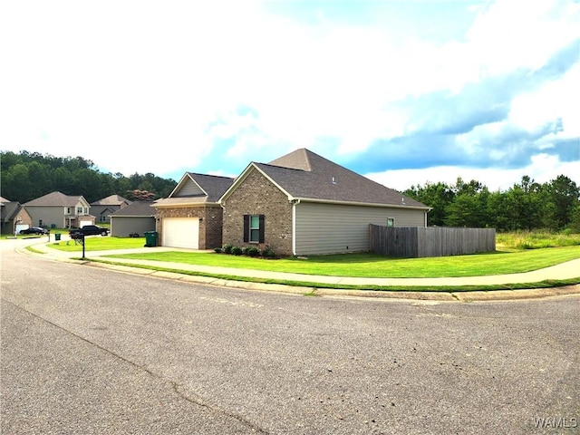 15525 Tide Water Ter, Brookwood, AL 35444 - view of side of property with brick siding, an attached garage, and concrete driveway