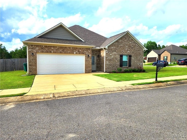 15525 Tide Water Ter, Brookwood, AL 35444 - view of front of property featuring brick siding, driveway, roof with shingles, and a garage
