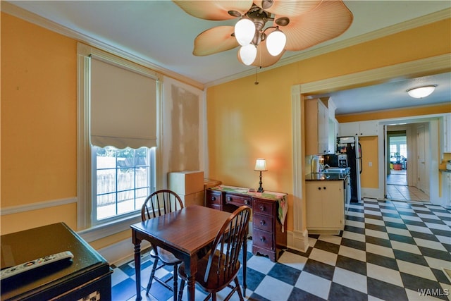 dining space featuring ceiling fan, a healthy amount of sunlight, and ornamental molding