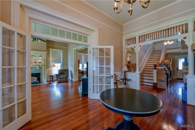 dining area with a healthy amount of sunlight, dark hardwood / wood-style flooring, and french doors