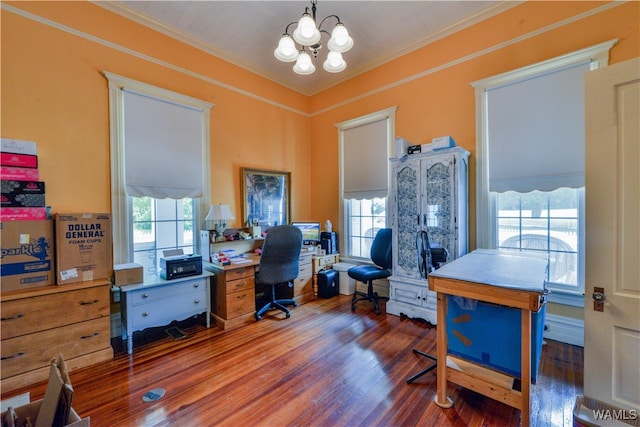 office featuring dark hardwood / wood-style floors, ornamental molding, and a notable chandelier