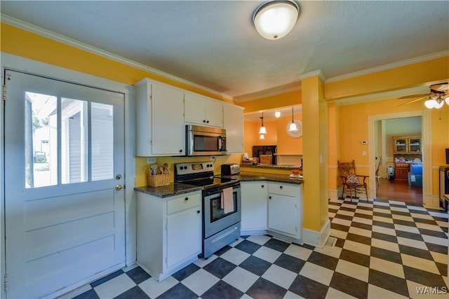 kitchen featuring white cabinets, ornamental molding, and appliances with stainless steel finishes