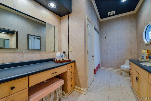 bathroom with tile patterned floors, crown molding, vanity, and toilet