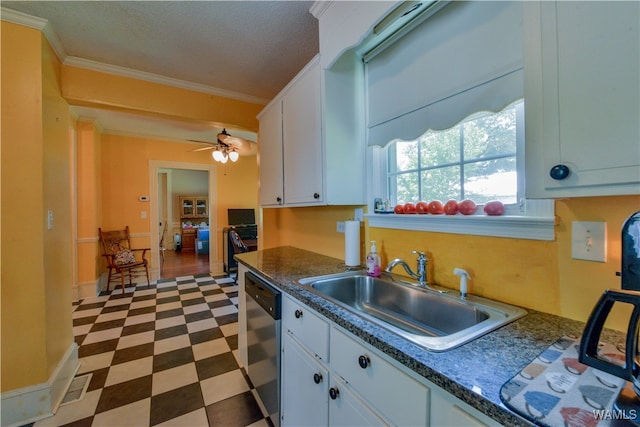 kitchen with white cabinets, sink, stainless steel dishwasher, ceiling fan, and ornamental molding