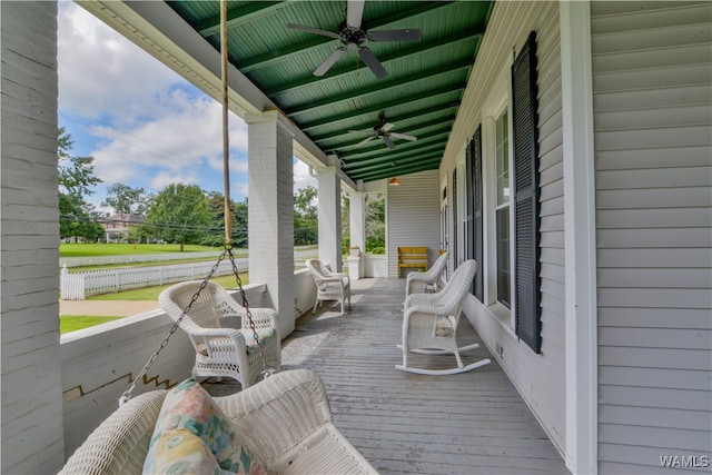 wooden deck with ceiling fan and a porch