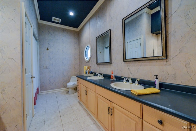 bathroom featuring vanity, toilet, and ornamental molding